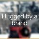 hugged by a brand
